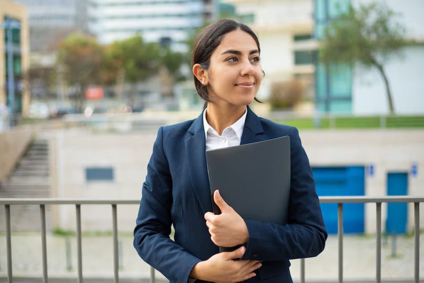 happy-businesswoman-holding-folder_74855-5075